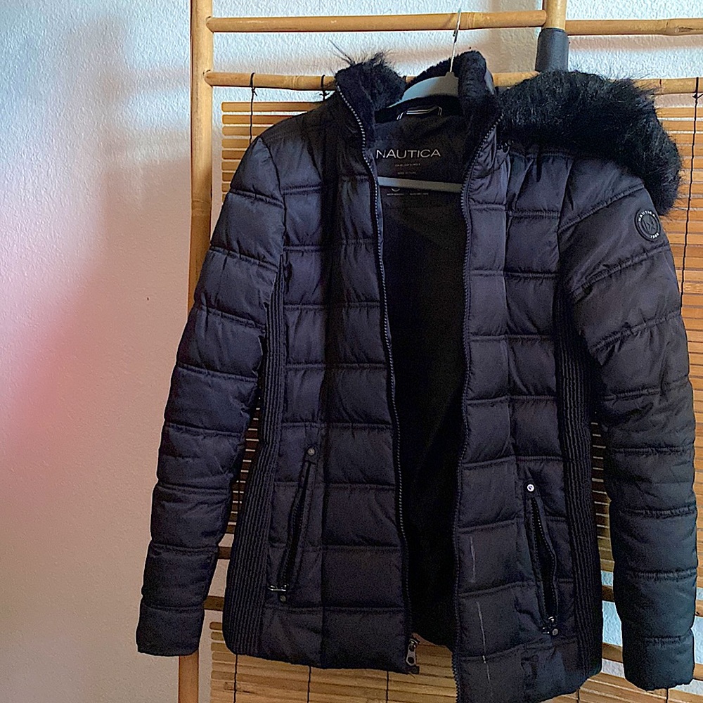 Super warm and cozy. For a small women. The hood is also removable.